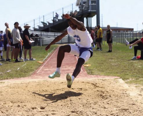Joseph Rolland Jr. finished first overall in the varsity long jump and triple jump at the Bluebird Relays in Wills Point last week. Story and additional photos on 10A. Photo by J. Shearin/WPISD Yearbook